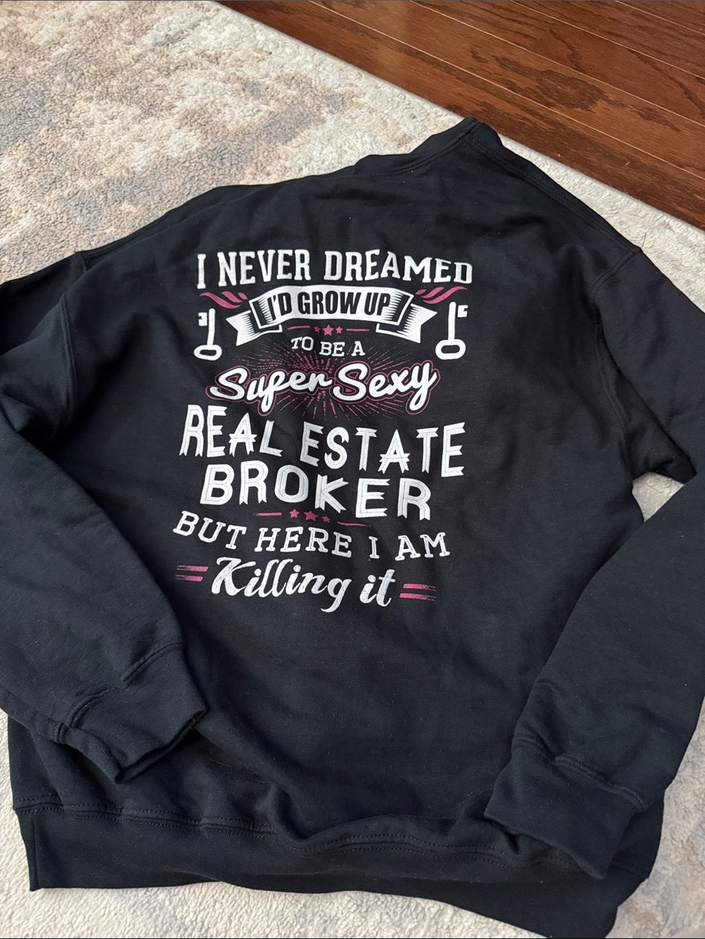 Gildan Black Crewneck Sweatshirt with White and Pink Real Estate Graphic